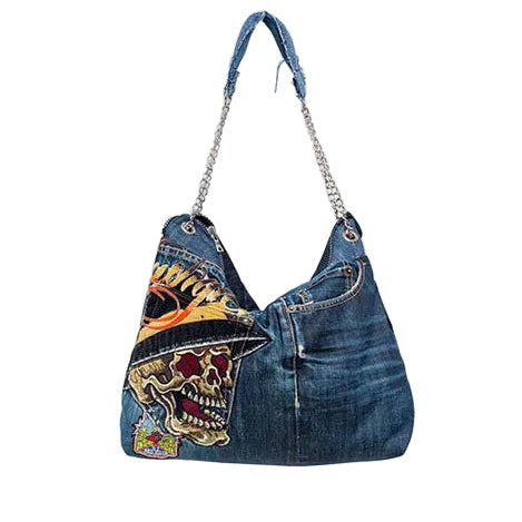 Denim handbag with patches on a white background