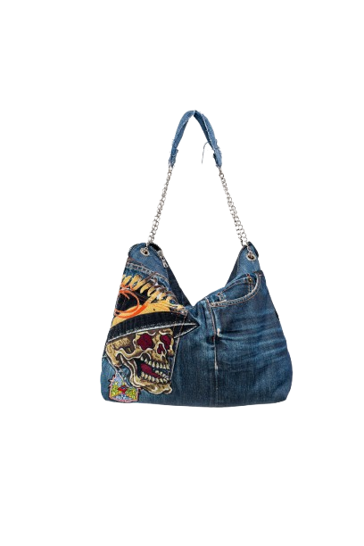 Denim handbag with colorful skull design on a white background