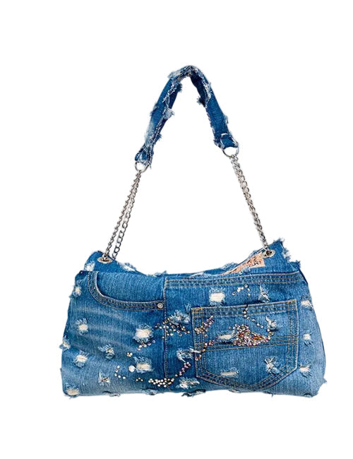 Denim handbag with floral embellishments on a white background