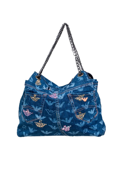 Blue denim handbag with floral patterns on a white background